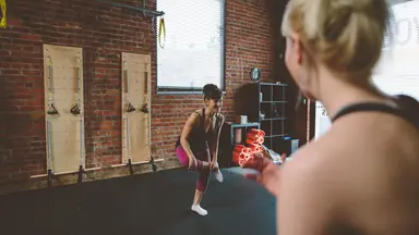 A woman teaching a stretching class
