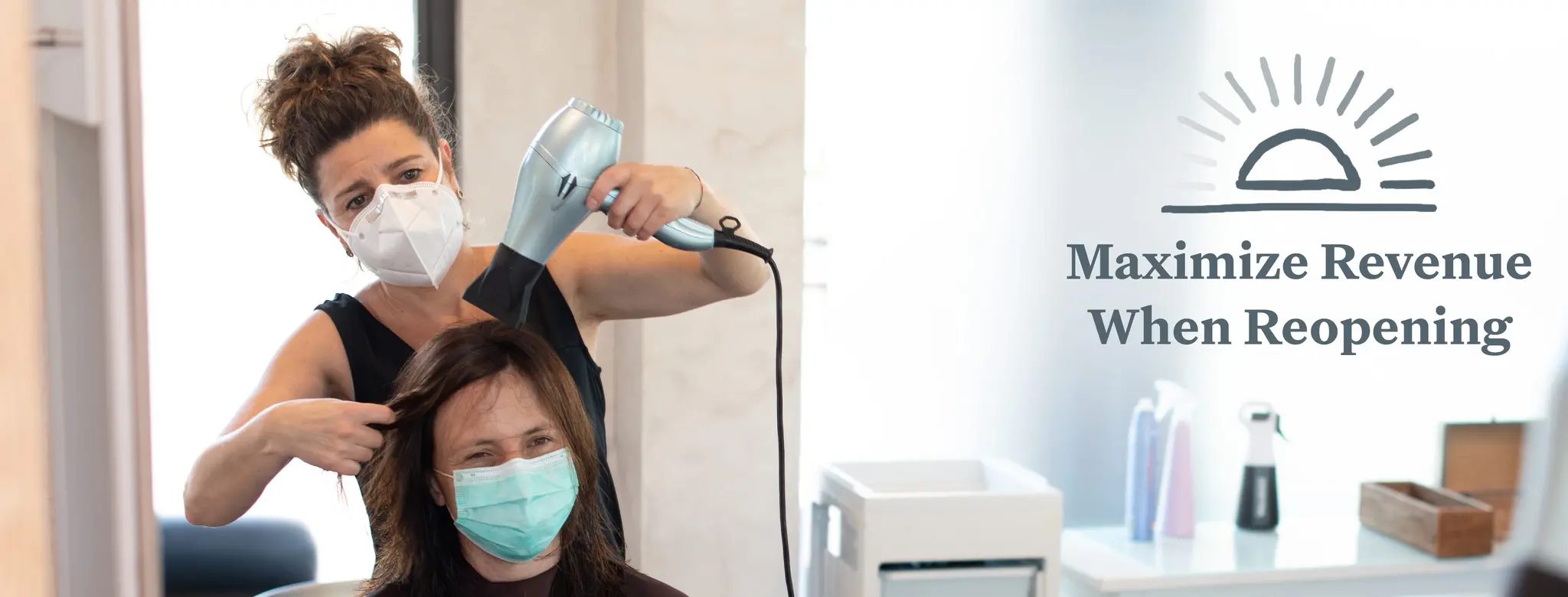 A hair stylist wears a mask while she blow dries a client's hair