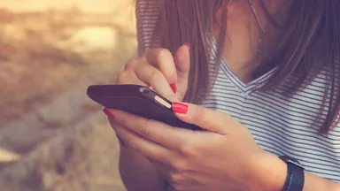 Woman texting on her phone.