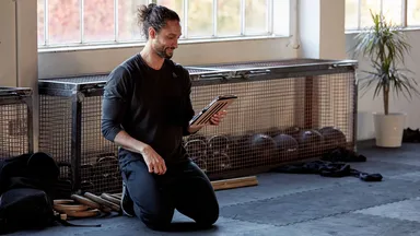 Man creating a Facebook ad on his iPad