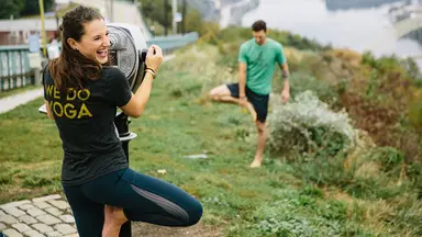 Woman laughing while doing yoga