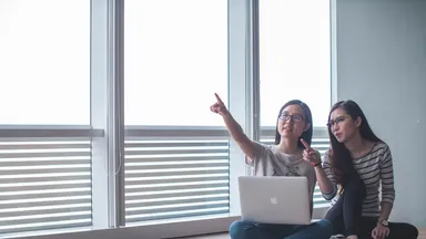 women evaluating business