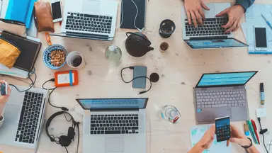 people on their computer at table