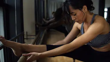 Woman stretching at the barre