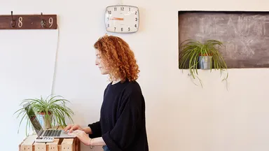 woman a front desk using laptop