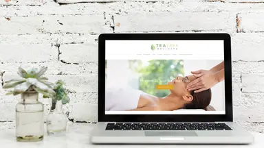 Laptop featuring Tea Tree Wellness website