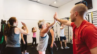 Clients give high-fives at McAlister Training