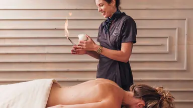 A woman performing cupping therapy at Yoso Wellness Spa