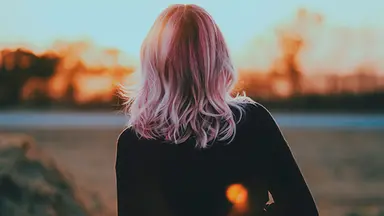 woman with pink hair outside