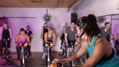 Instructor teaches a cycling class