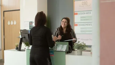 two women at desk in salon spa