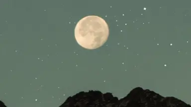 moon in sky over mountains