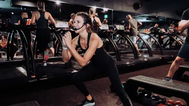 Woman instructing a fitness class at Shred415