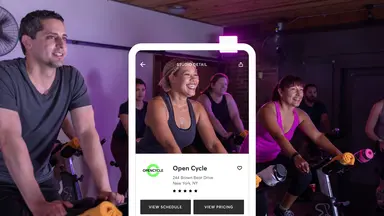man and women working out in a spin class