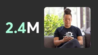 2.4M and a woman on her smartphone.