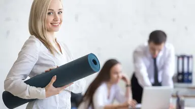 Fitness entrepreneur woman holding a yoga mat getting business financing