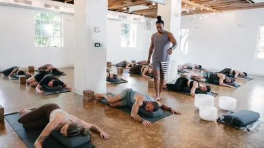 Clients and an instructor in a yoga class