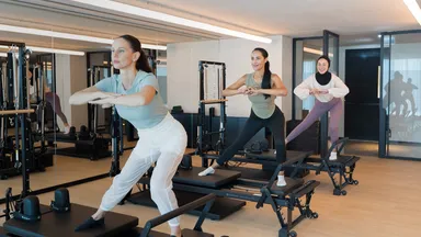 Three women in a Pilates class