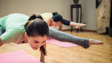 2 women in a yoga class