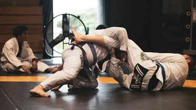 2 martial arts students on the mat