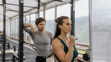A personal trainer working with a client.