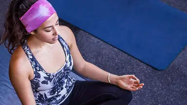 Person sitting in yoga pose