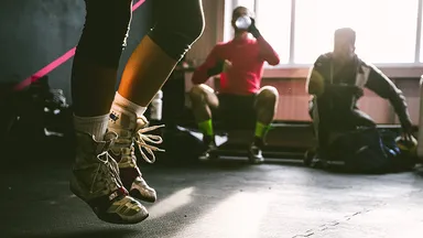 three men working out in a gym