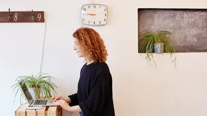 woman a front desk using laptop