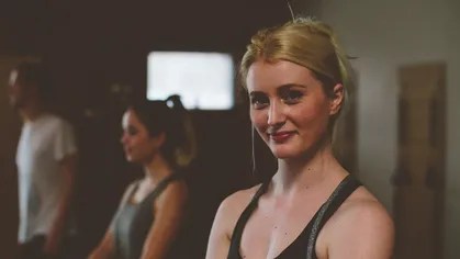 Smiling woman in fitness studio