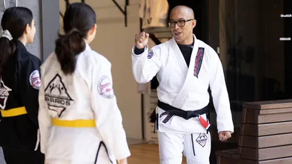 Martial arts instructor and students