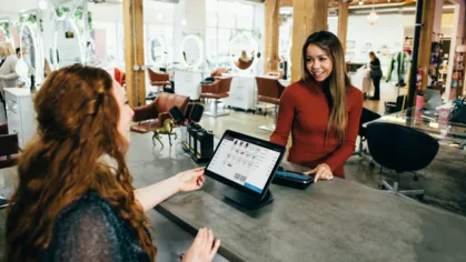 Woman checking in at hair salon