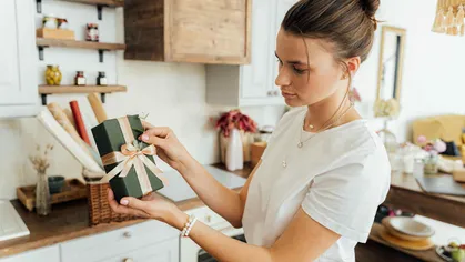 business owner preparing for the holidays and wrapping gifts