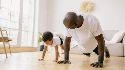 A father exercising with his son.