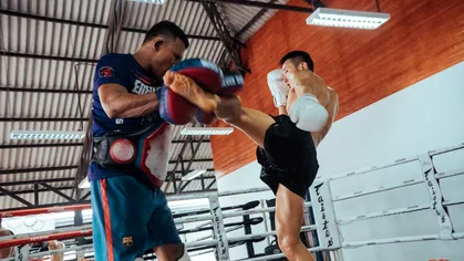 Two men practicing martial arts.