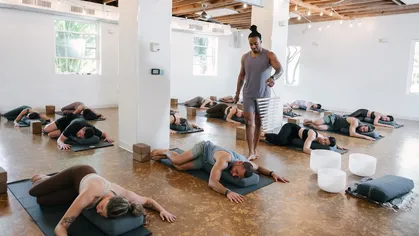 Clients and an instructor in a yoga class