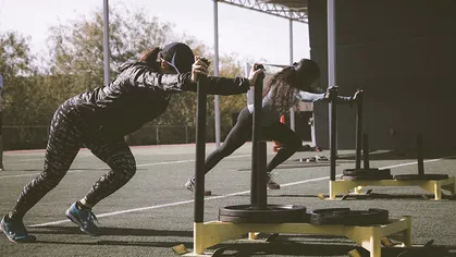 Women pushing weight sleds