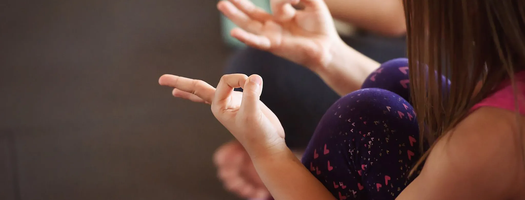 Child practicing yoga at Be Hot Yoga