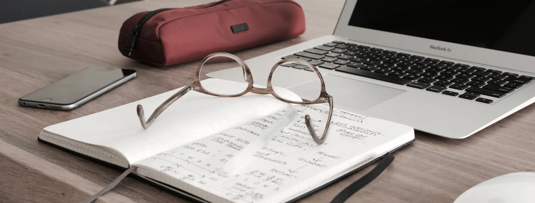 laptop notebook glasses on desk