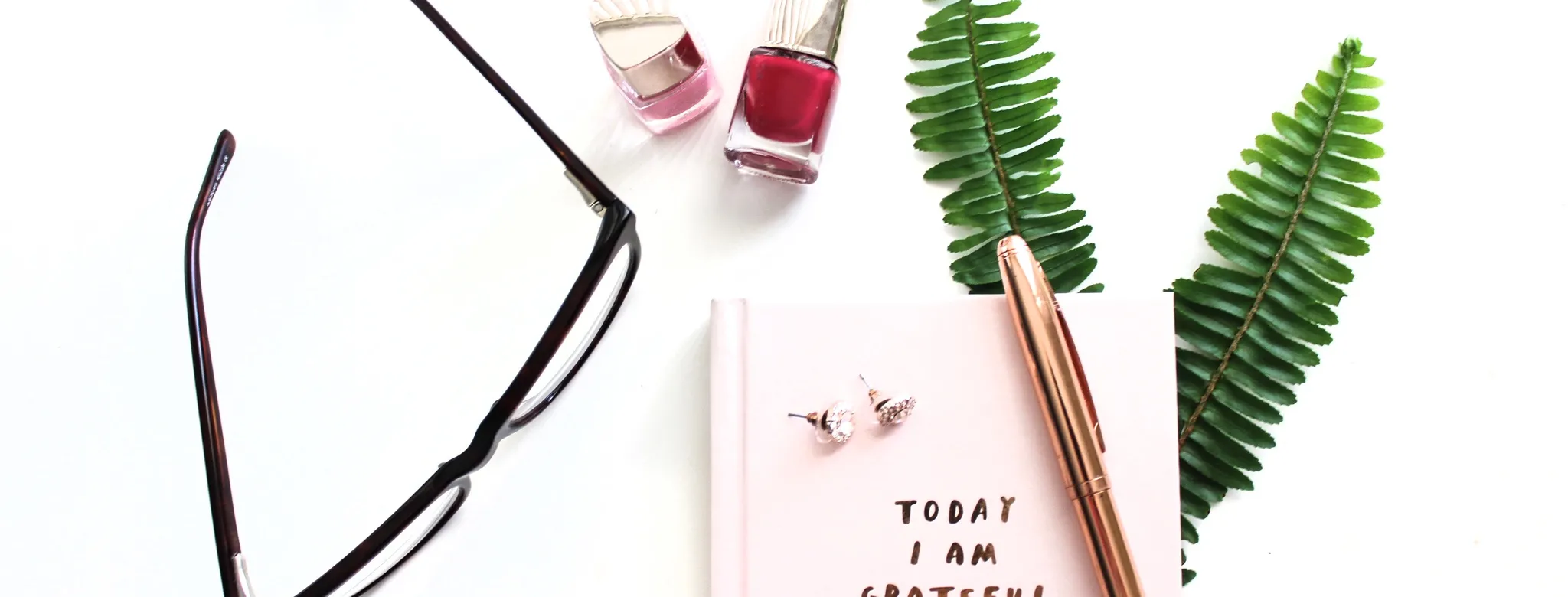 glasses and journal sitting on desk