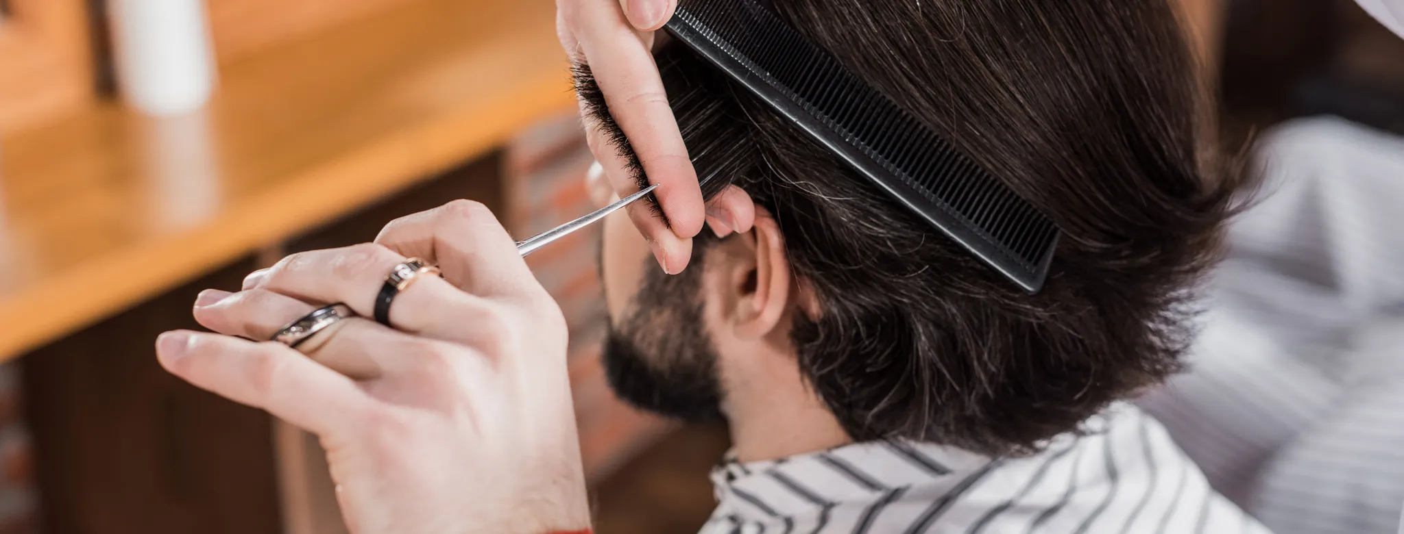 man getting haircut at barbershop