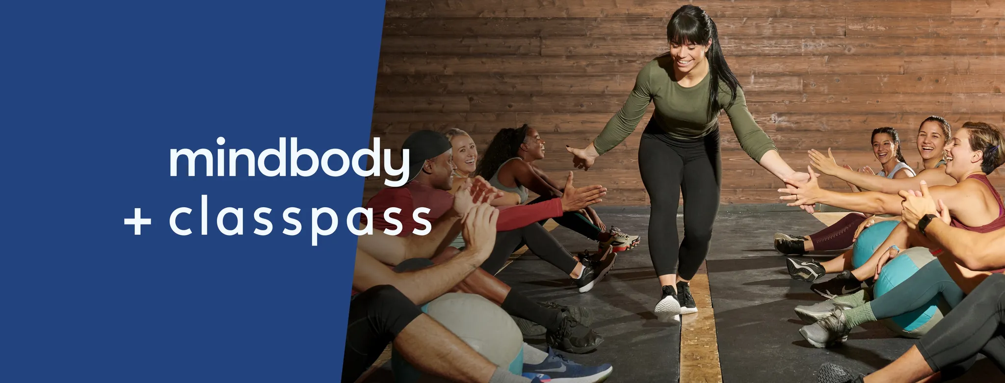 Mindbody + ClassPass with instructor giving high-fives