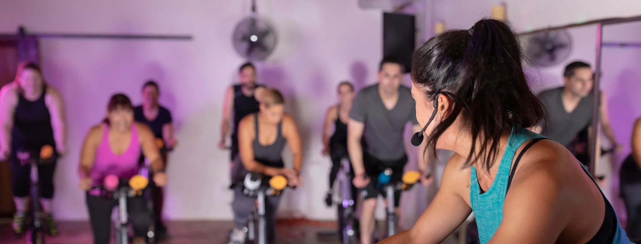 Instructor teaches a cycling class