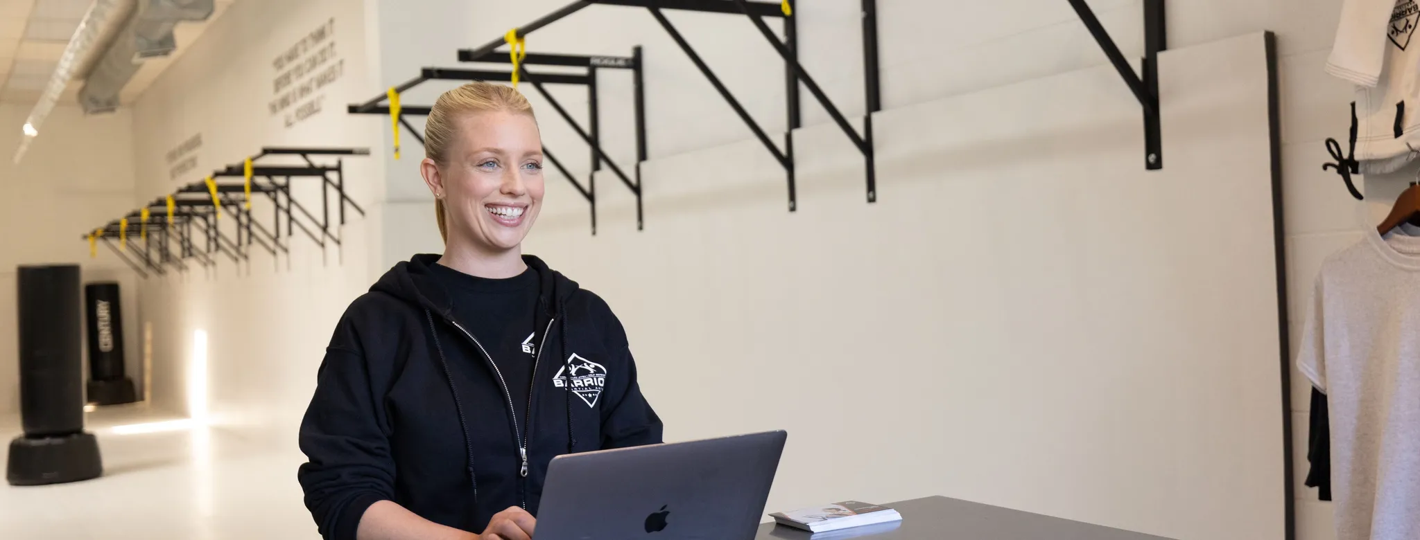 Front desk at martial arts academy with retail section