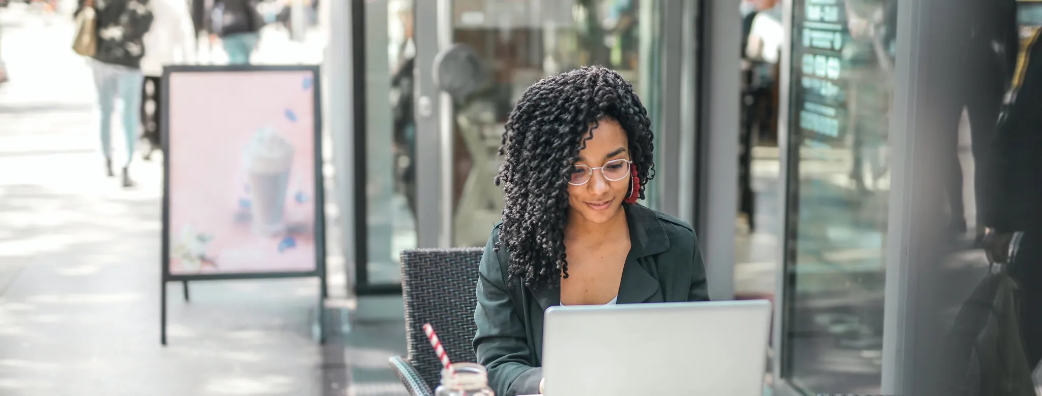 woman on laptop outside 