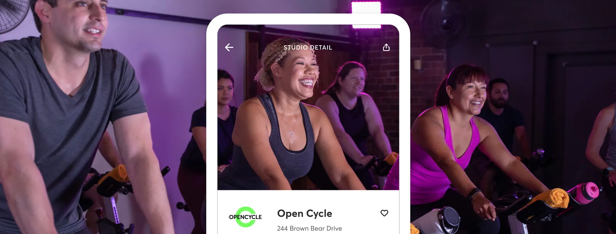 man and women working out in a spin class