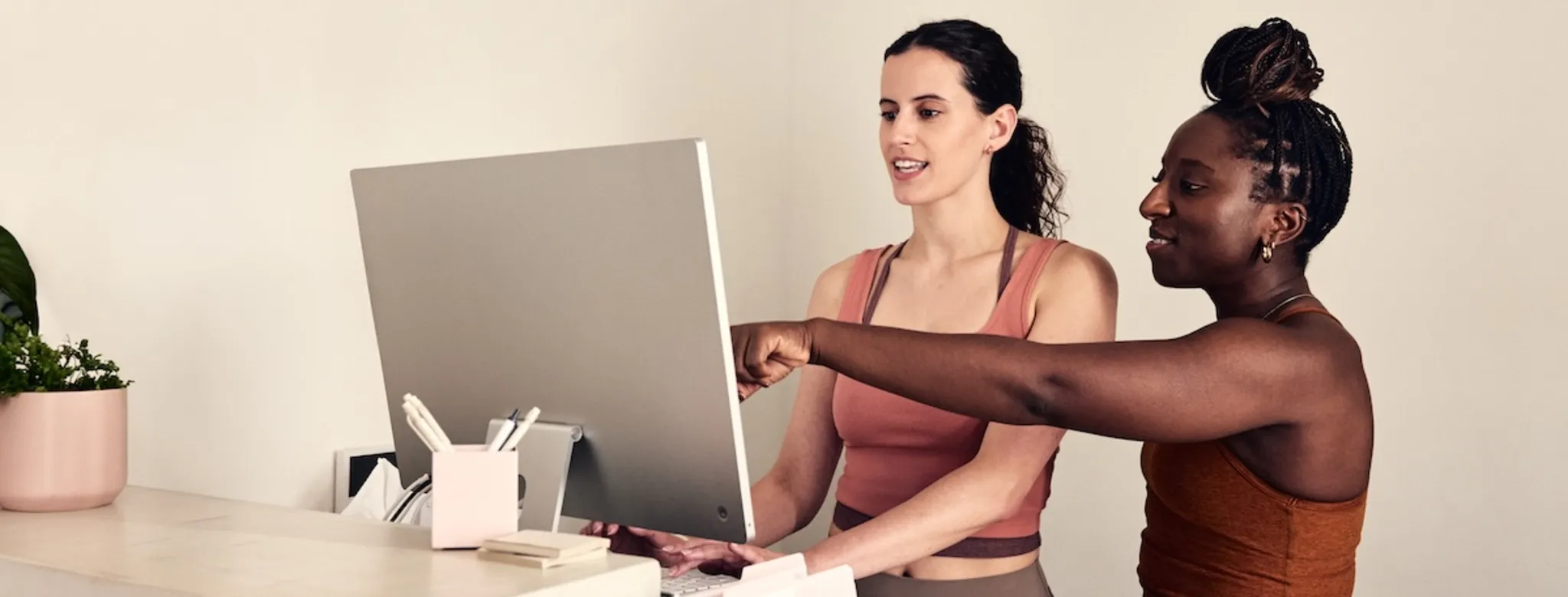 Two employees at the front desk 