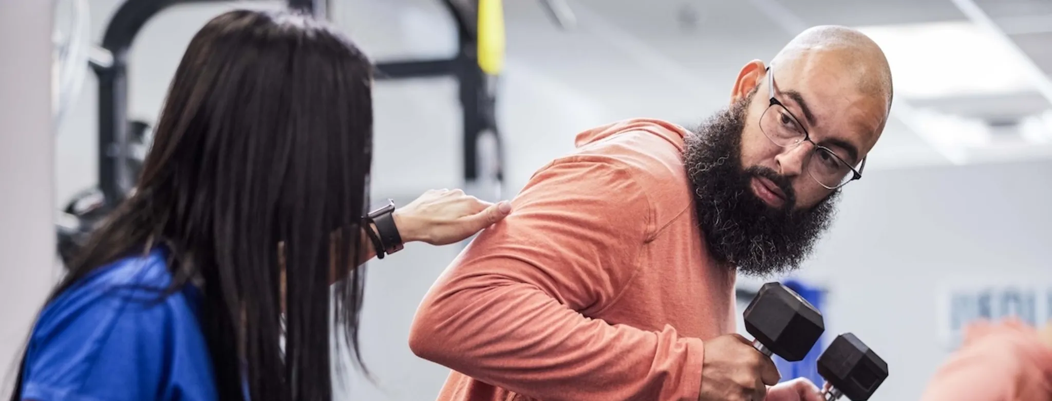 A man training with his personal trainer