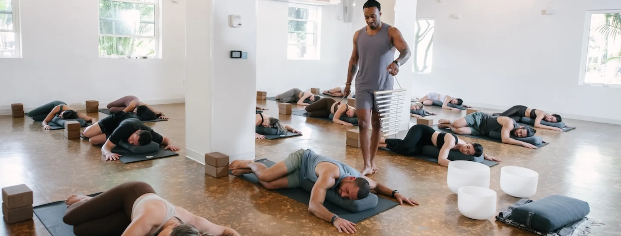 Clients and an instructor in a yoga class