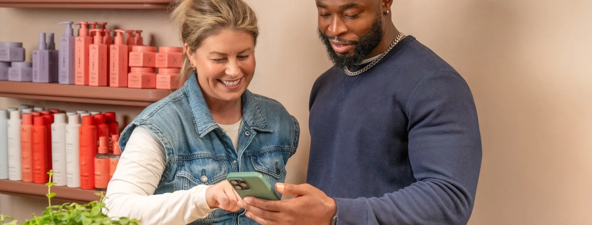 Two people using a phone