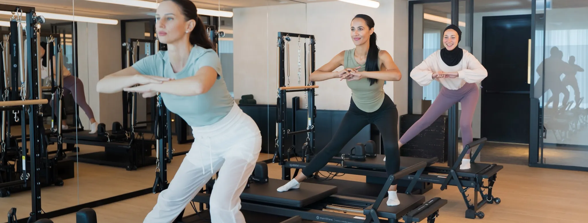 Three women in a Pilates class